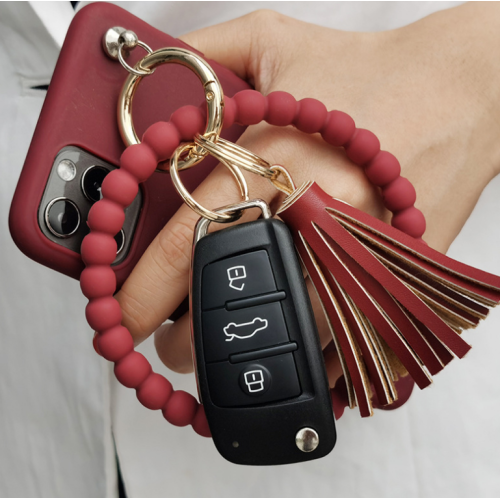 Bracelet de porte-clés perlé en silicone personnalisé avec gland