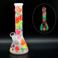 A glass water pipe with a colorful mushroom pattern