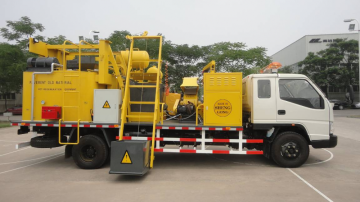 Road pothole repairing machine