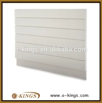 Cream fabric covered hotel bed headboard