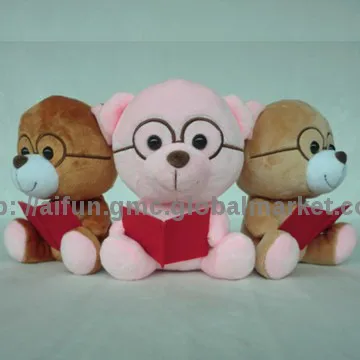 Cute bear toys wearing glasses, and reading book