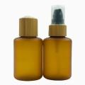 Amber frosted plastic lotion bottle with bamboo lid