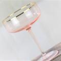 hand blown champagne saucer glass with gold rim