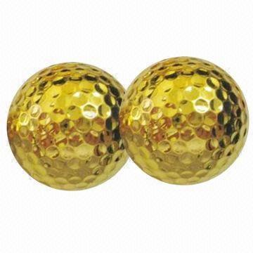 Gold color golf balls, used in tournaments
