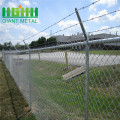 Galvanized chain fence with top barbed wire