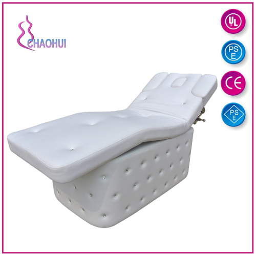 White electric massage table for spa