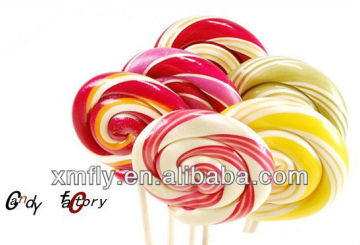 Customized wholesale big flat swirl rainbow hard coated fruity twisted lollipop