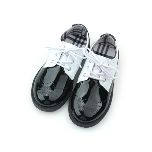 Zapatos casuales para niños en blanco y negro de cuero de Quanlity