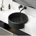Stainless steel wash basin with black countertop