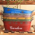 Retro made old iron flower arrangement bucket