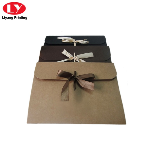 Kraft paper envelope with ribbon closure