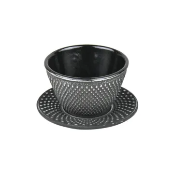 Cast iron tea cups and saucers