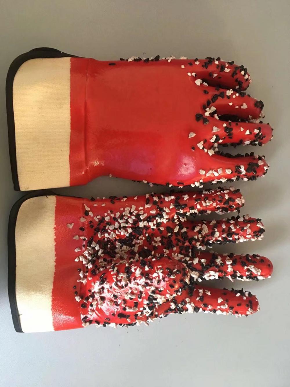 Red pvc gloves with chips on the palm