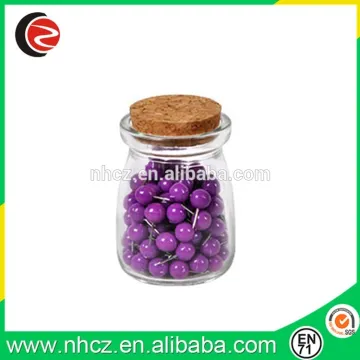 Round Purple Push Pin in glass bottle