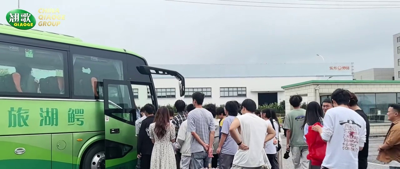 Students queue up at Qiaogue Factory to board the bus
