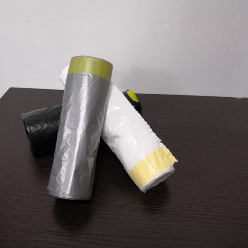 Plastic disposable drawstring trash bags on rolls for kitchen household can bins