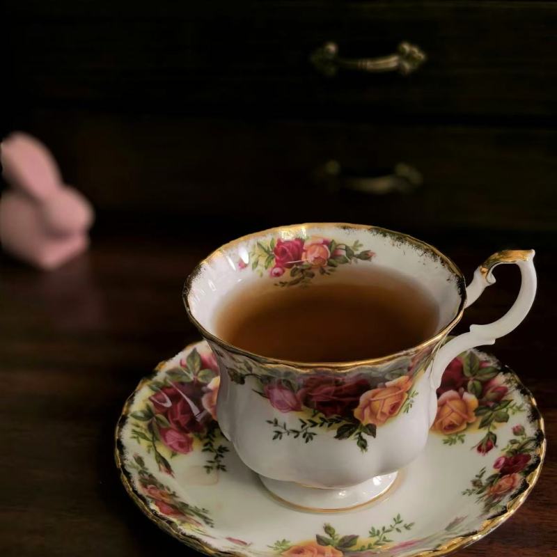Elegant Porcelain Tea Set with Floral Design and Gold Trim