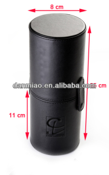 Classic black leather round can for packing brushes