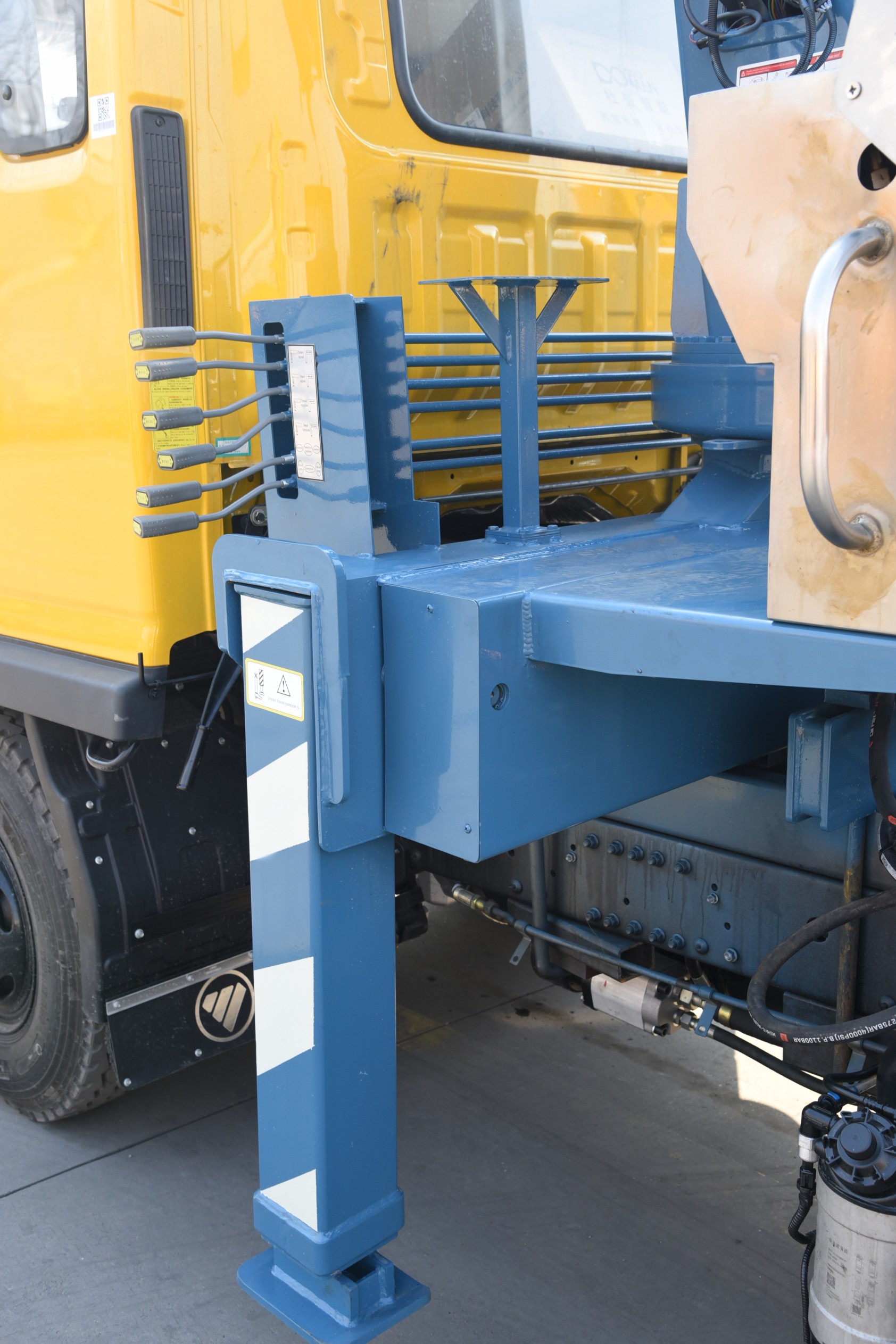 Multi-functional truck-mounted crane with drill bit