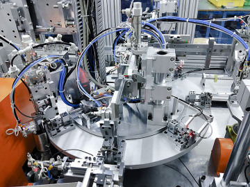 Automotive rocker arm assembly machine