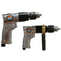 Reversible pneumatic hand drill