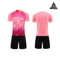 Conjunto de mono de fútbol rosa para entrenamiento deportivo de adultos.