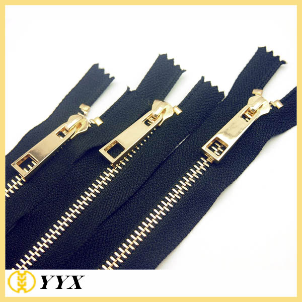 9 black zipper with gold pull