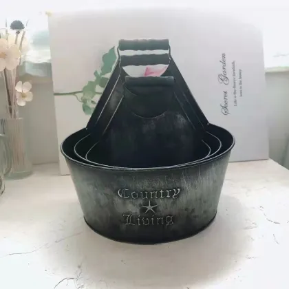 Old dark grey embossed iron drum
