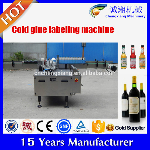 Low price automatic round bottle labeling machine,cold glue labeling machine