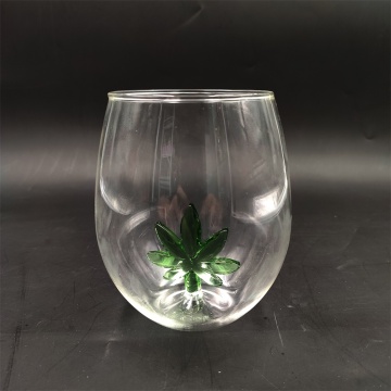 Heat resistant wine glass with green tree inside