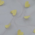Tessuto a rete in nylon con stampa a sbuffo di cuori dorati iridescenti