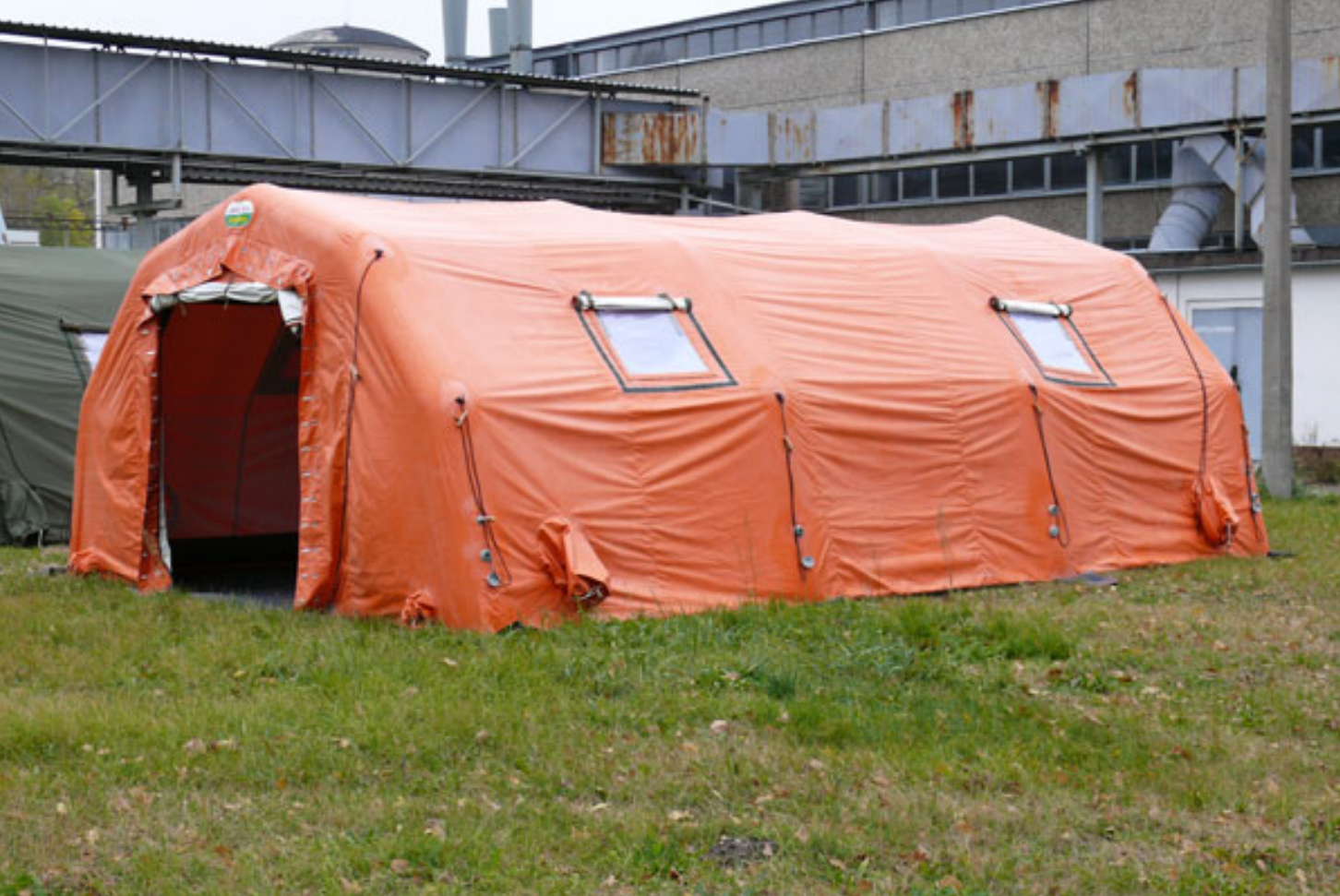 Orange emergency tent deployed outdoors