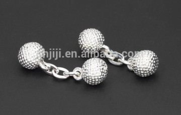 Golfball cufflinks with chain to contact