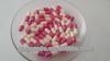 2 pink empty gelatin capsules