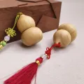 Butelka na kółkach z naturalnej bambusowej tykwy