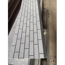 Metal Carved Panels With Water Patterns Covering Brick Patterns