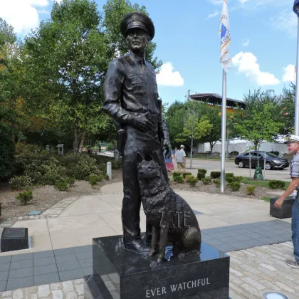 Outdoor garden life size bronze police man and police dog statue