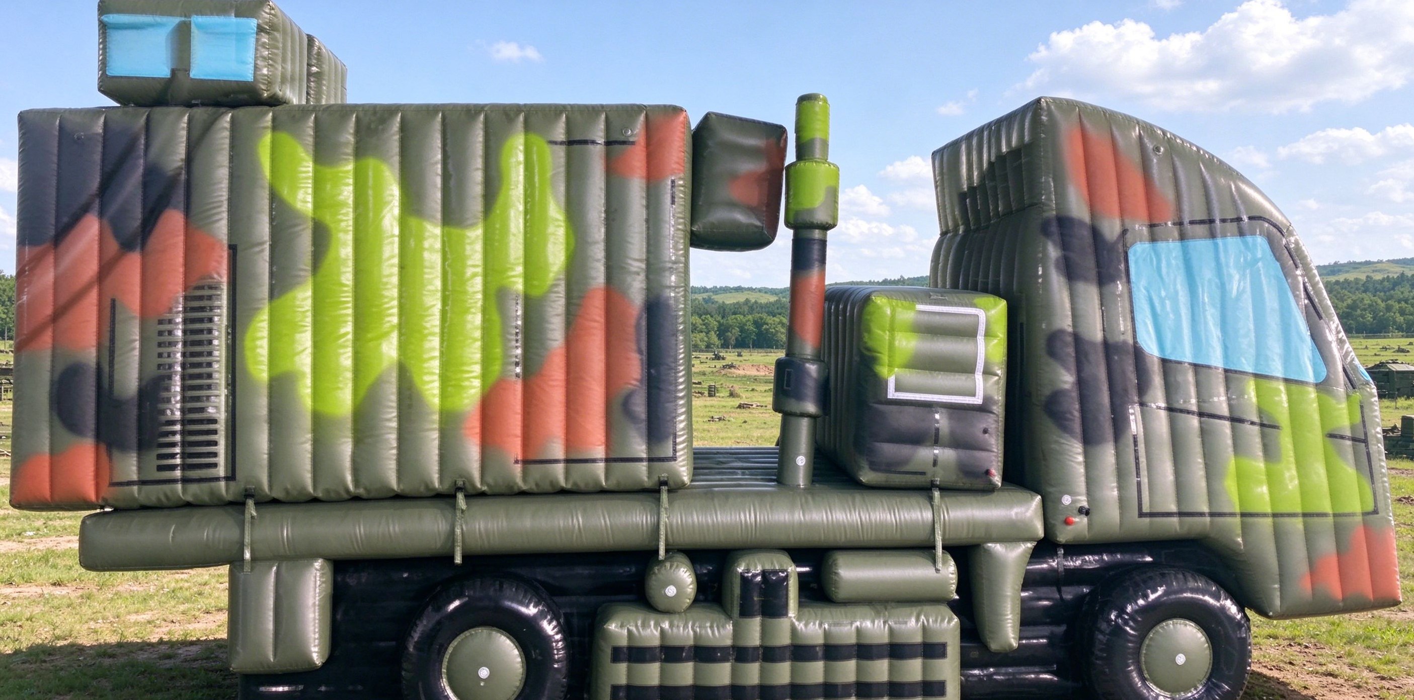 Inflatable camouflage truck decoy in a warehouse