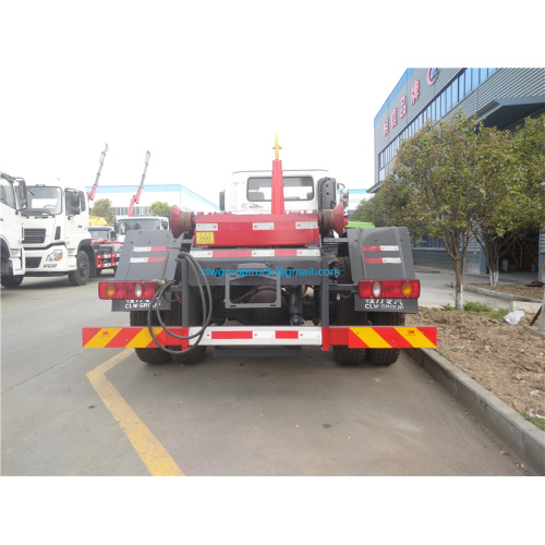 Camión de basura con gancho con caja de basura comprimida