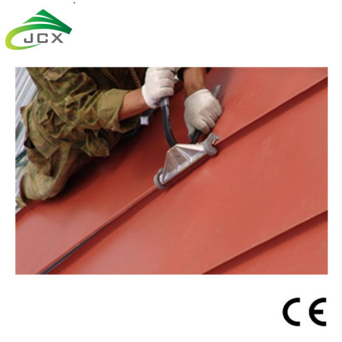 Portable standing seam roof machine