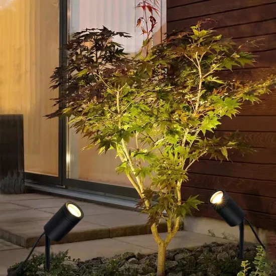 Serene Outdoor Courtyard with Garden Relaxation Area and Warm Tree Lighting