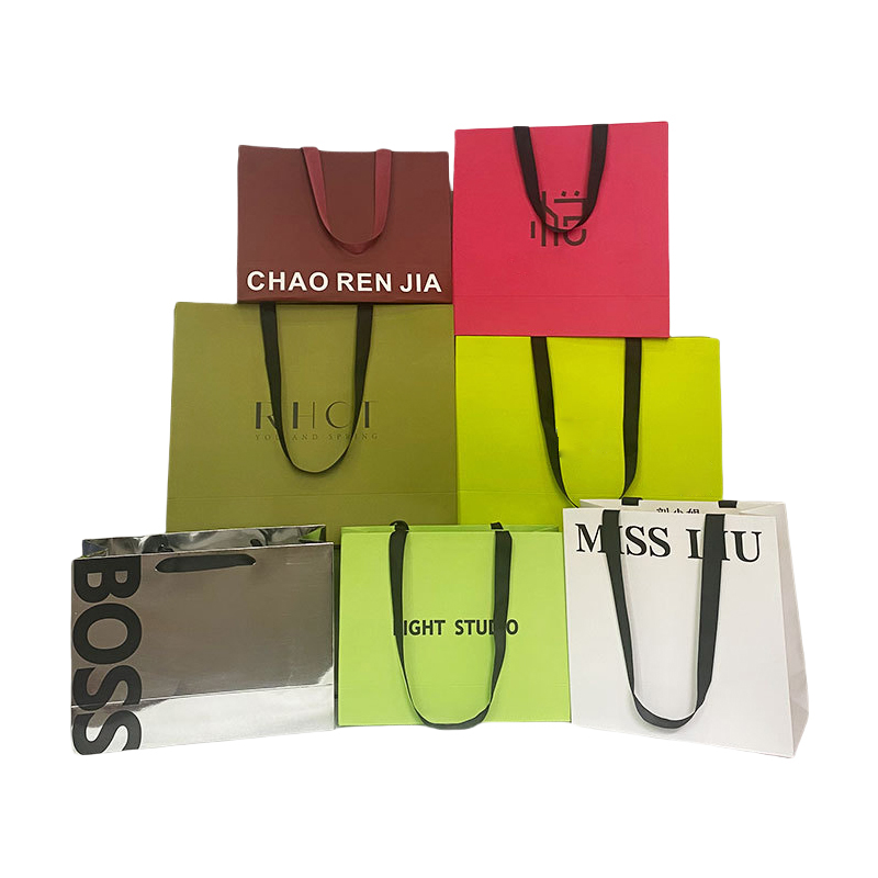Paper luxury bag with ribbon handle