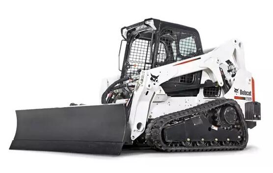 Bobcat skid steer loader operating in a port bulk material warehouse