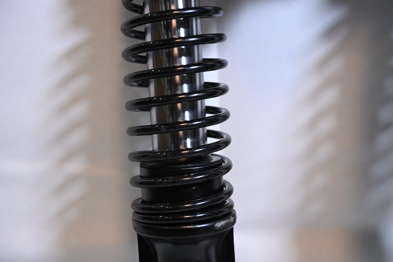 Close-up of the hydraulic anti-bottoming mechanism that stops harsh impacts