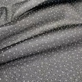 Tessuto jersey lavorato a maglia con pois glitter dorati