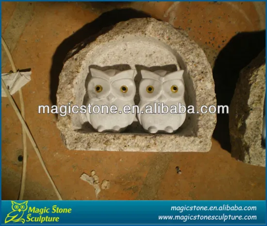 white stone owl sculpture