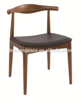 designed Wegner wooden elbow chair