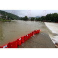 Temporary traffic flood defence aqua dam water barrier