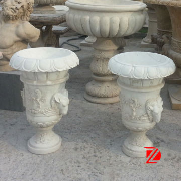 Flower pots with goat head statues