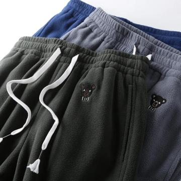 Pantalon en micro-polaire pour hommes avec broderie